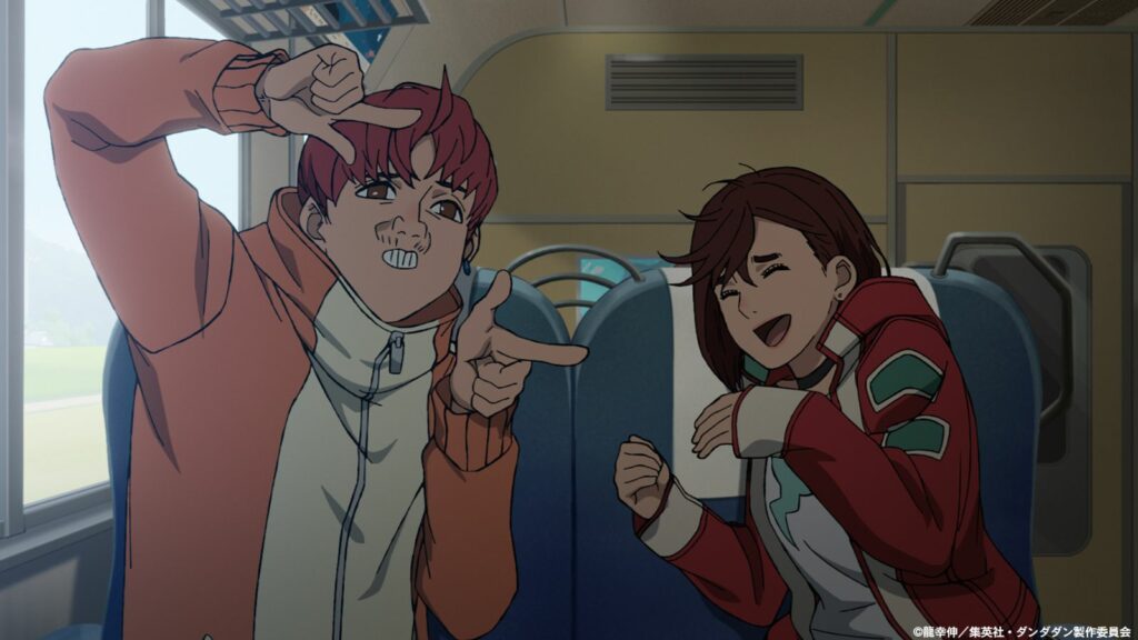 Where does the Dandadan anime end in the manga? Dandadan main characters Momo Ayase and Jin "Jiji" Enjoji seen in a train during episode 12 season 1